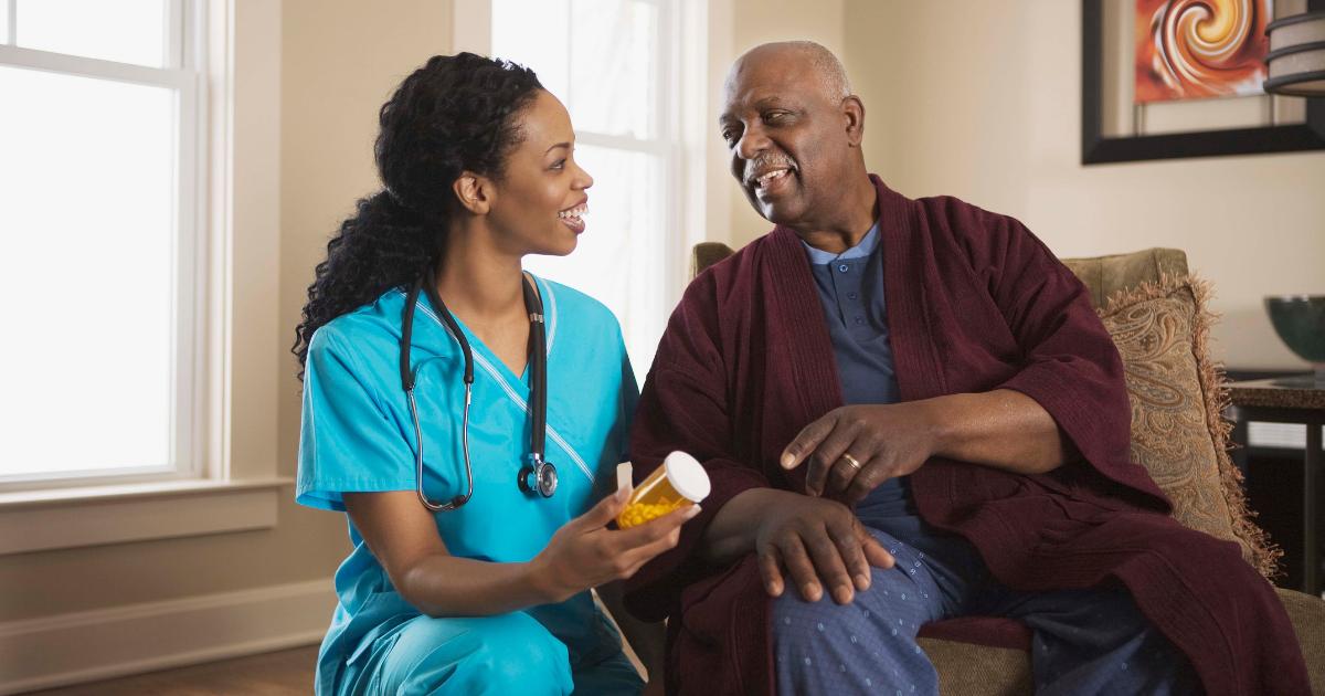Caregiver helping elderly client